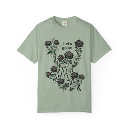 Sage green t-shirt with rose wreath graphic and “Let’s grow” slogan, soft cotton