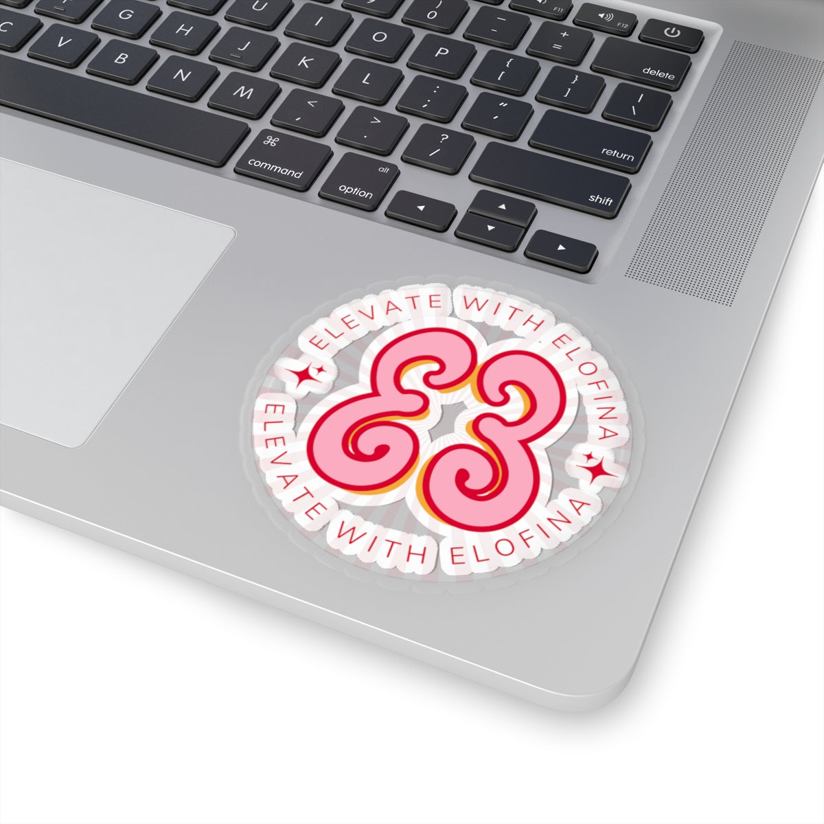 Laptop sticker, pink hello love swirl design on light gray aluminum surface