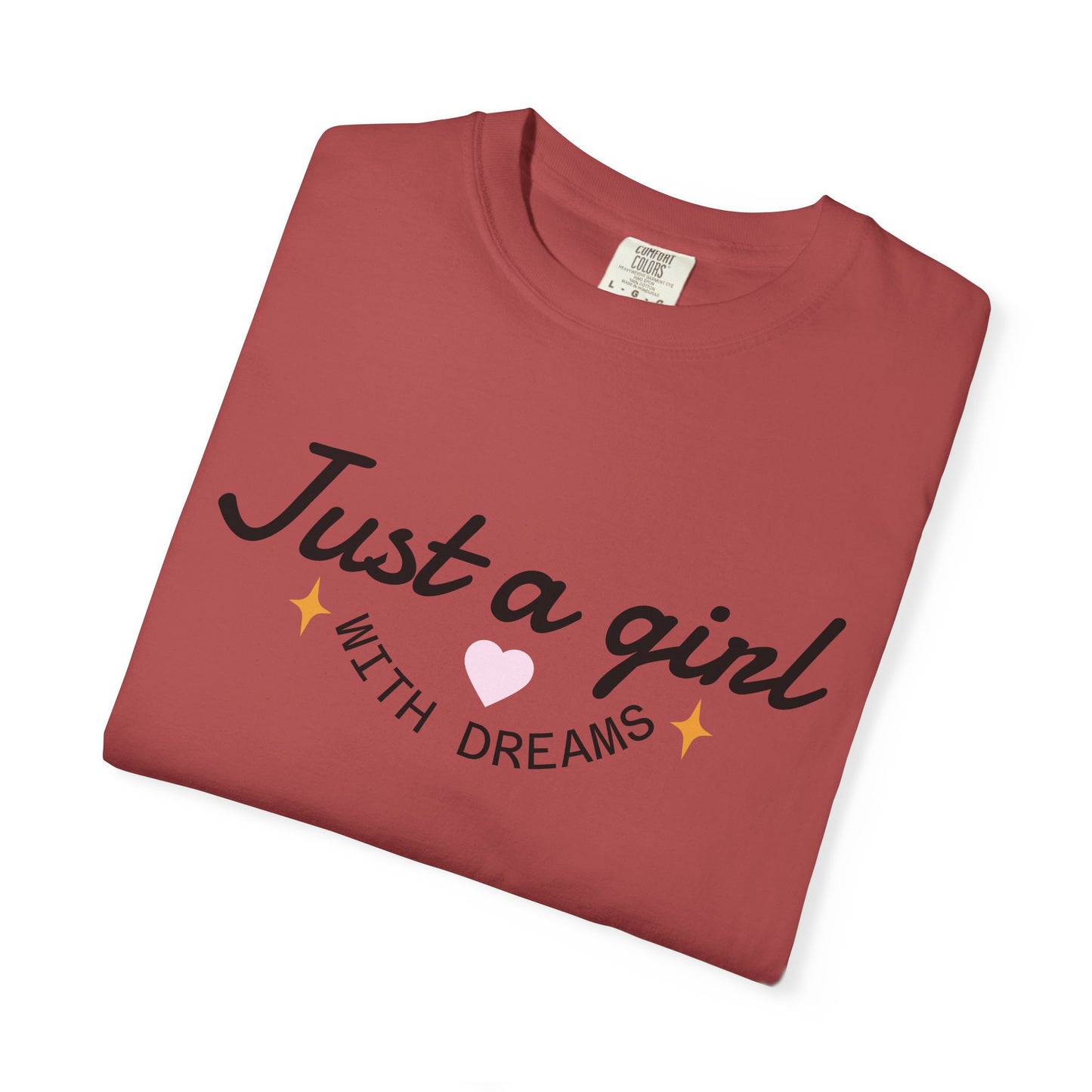 Terracotta t-shirt featuring 'Just a girl WITH DREAMS' text and a pink heart illustration.