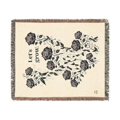 Beige floral woven scarf blanket with fringe trim, soft cotton blend—rose and green leaf print