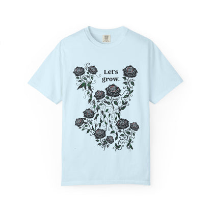 Light blue graphic t-shirt with black roses and “Let’s grow” slogan, cotton blend