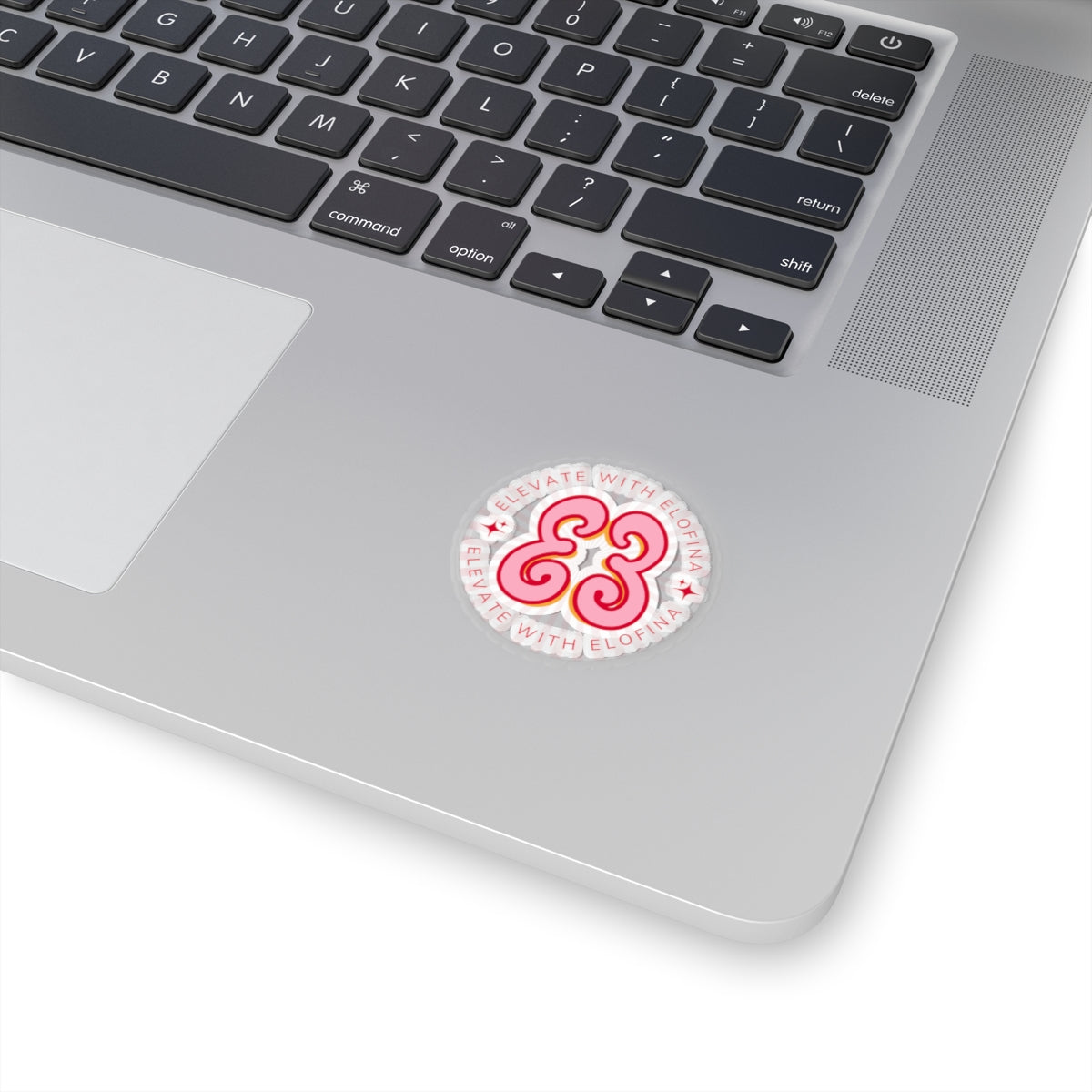 White MacBook keyboard skin with black keys, protective silicone cover and decorative logo sticker