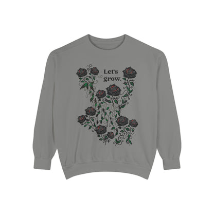 Grey sweatshirt with rose wreath graphic and “Let’s grow” slogan, soft cotton blend