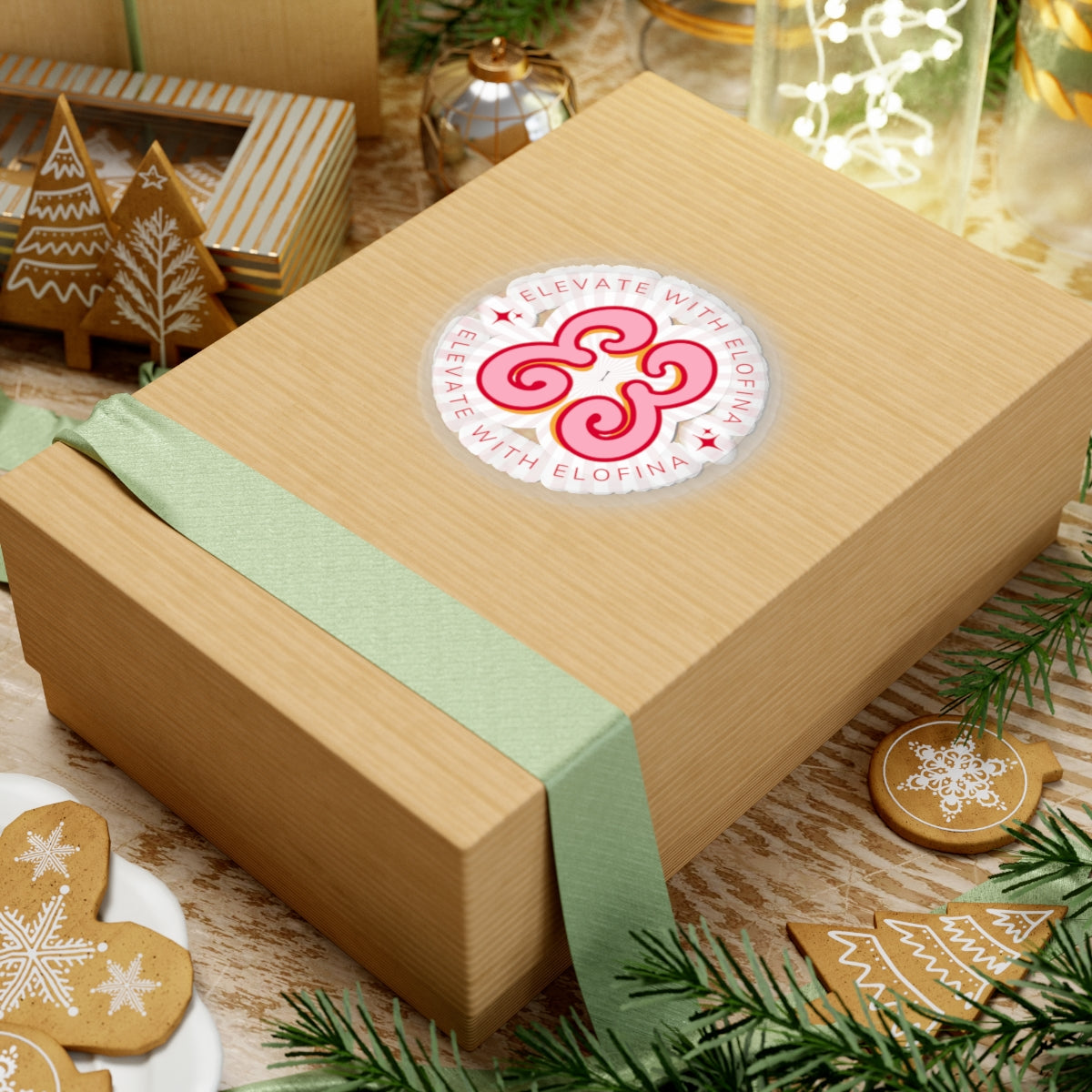 Christmas gift box in natural wood tone with green ribbon and brand sticker