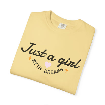 Pale yellow t-shirt with black text reading 'Just a girl WITH DREAMS' and small pink heart.