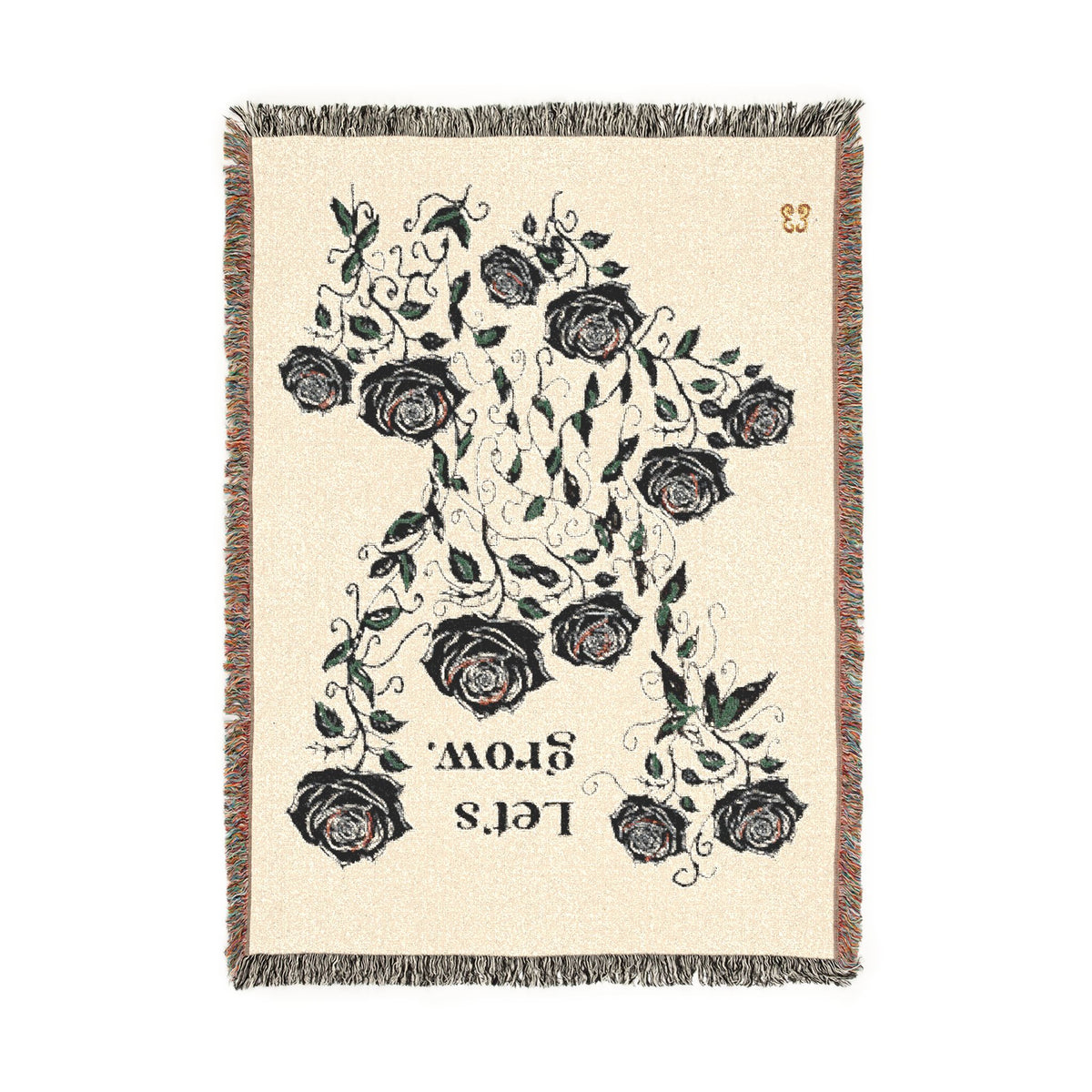 Ivory floral rug with black roses print and fringe edges, woven polyester