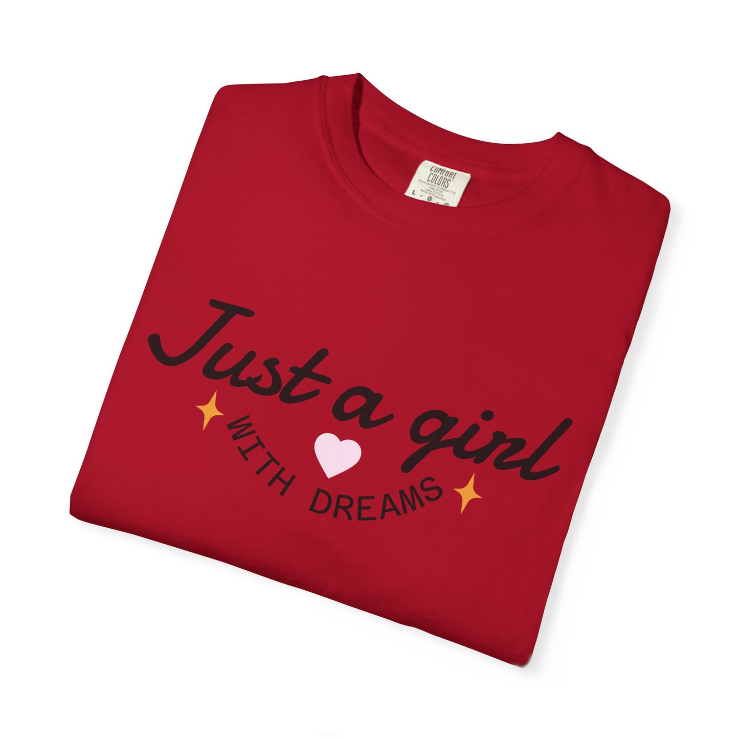 Red t-shirt featuring the text 'Just a girl WITH DREAMS' with a pink heart and yellow stars.