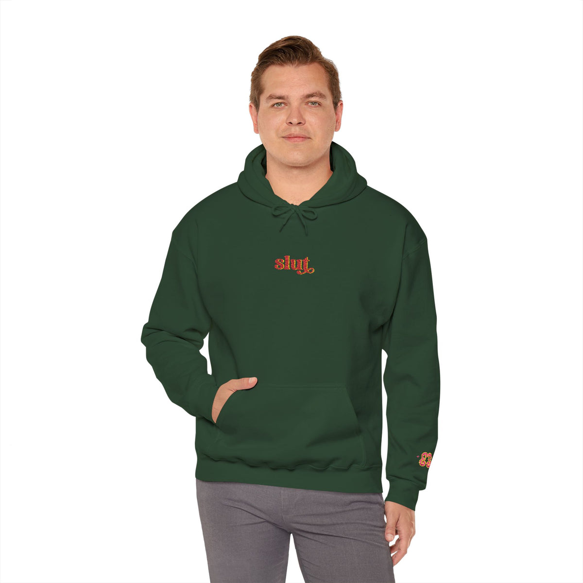 Forest green hoodie with “Slut” chest logo and small left-sleeve butterfly graphic