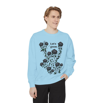 Light blue sweatshirt with rose floral graphic and “Let’s grow” print, soft cotton-blend fabric