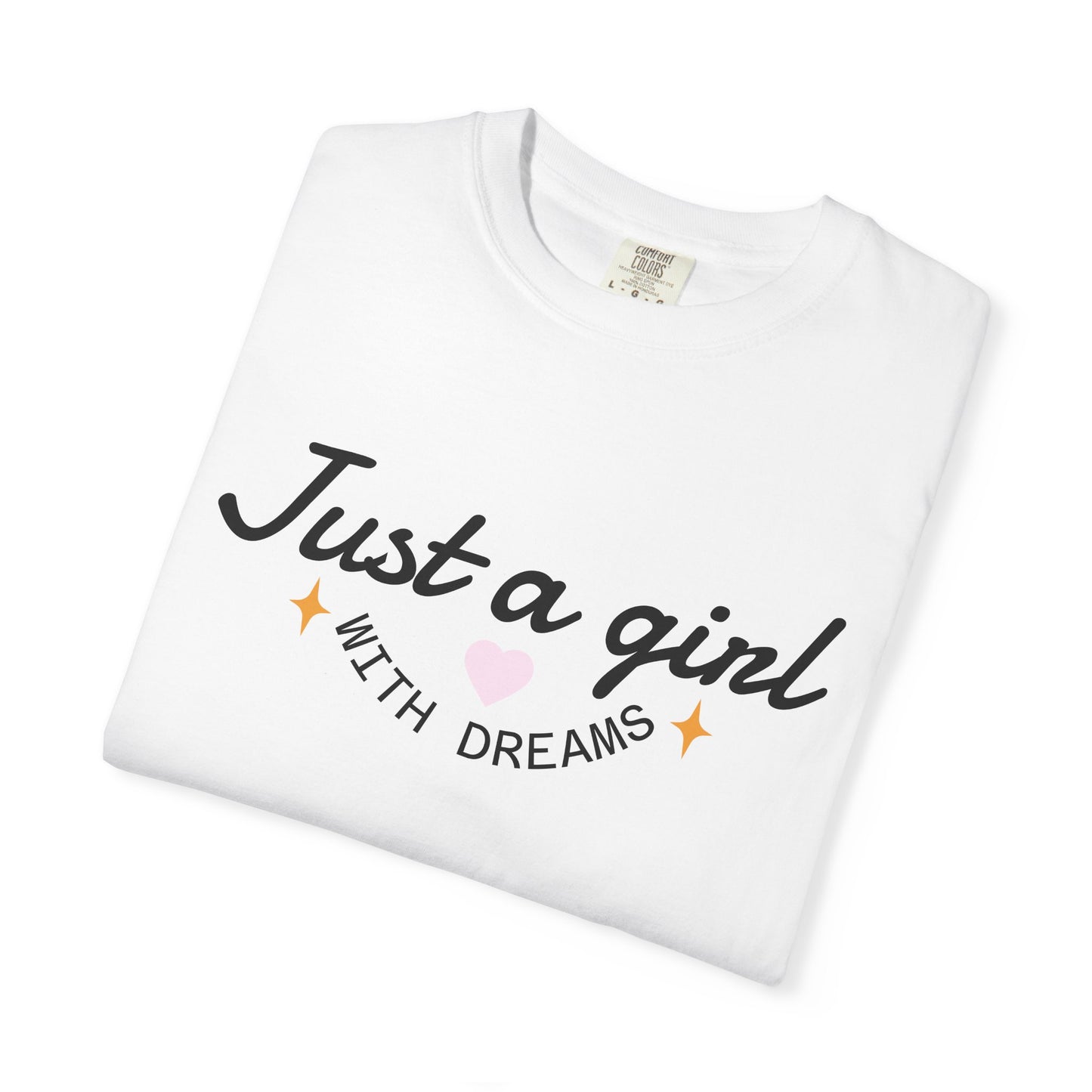White t-shirt with 'Just a girl WITH DREAMS' text, a pink heart, and gold sparkles.