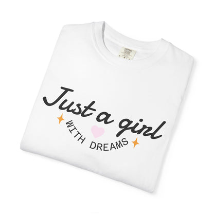 White t-shirt with 'Just a girl WITH DREAMS' text, a pink heart, and gold sparkles.