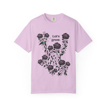 Lavender t-shirt with black rose floral graphic and “Let’s grow” slogan, soft cotton blend