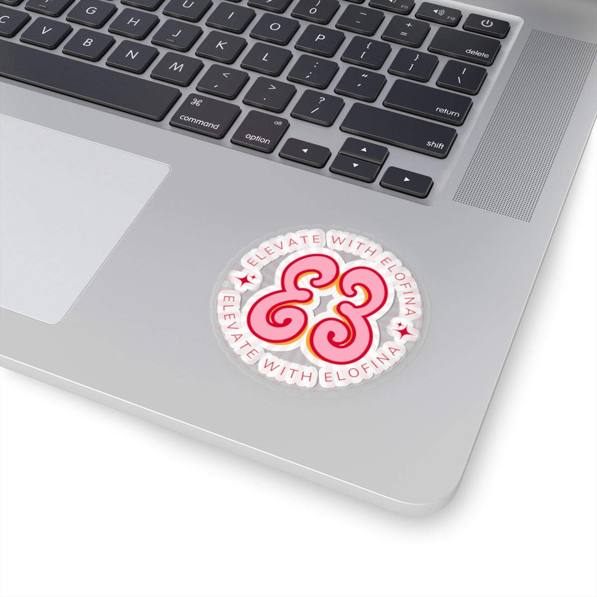 White laptop keyboard skin with “Elevate With Elofina” pink graphic sticker