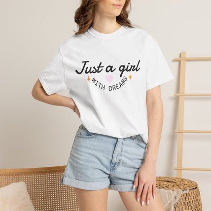 Woman wearing a white t-shirt with 'Just a girl WITH DREAMS' text and a pink heart.
