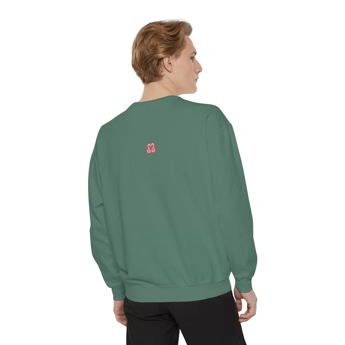 Green crewneck sweatshirt with small pink embroidered logo patch on back, soft cotton blend