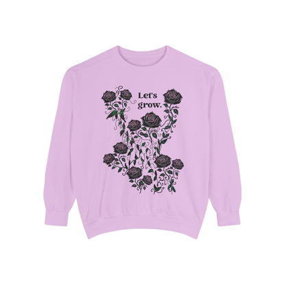 Lavender sweatshirt with black rose floral wreath and “Let’s grow” graphic print