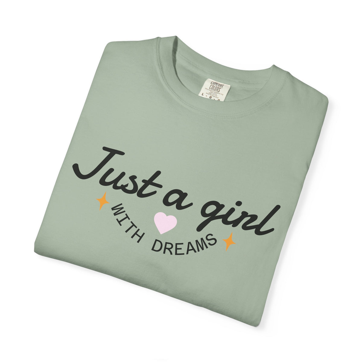 Sage green t-shirt with 'Just a girl WITH DREAMS' text and a pink heart.